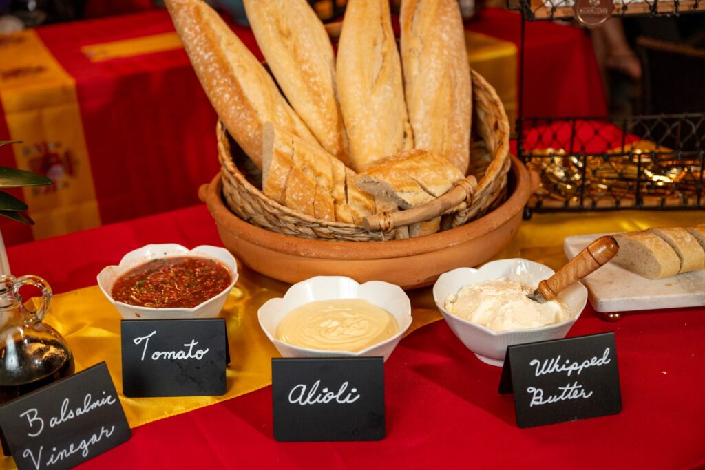Bread basket with tomato, alioli, whipped butter and balsamic