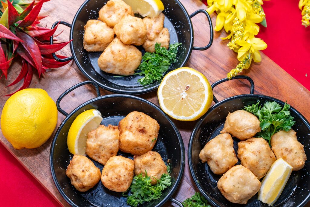 Overhead view of adobo fish cube tapas