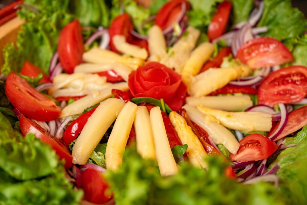 Spanish mixed salad with white asparagus and a tomato rose
