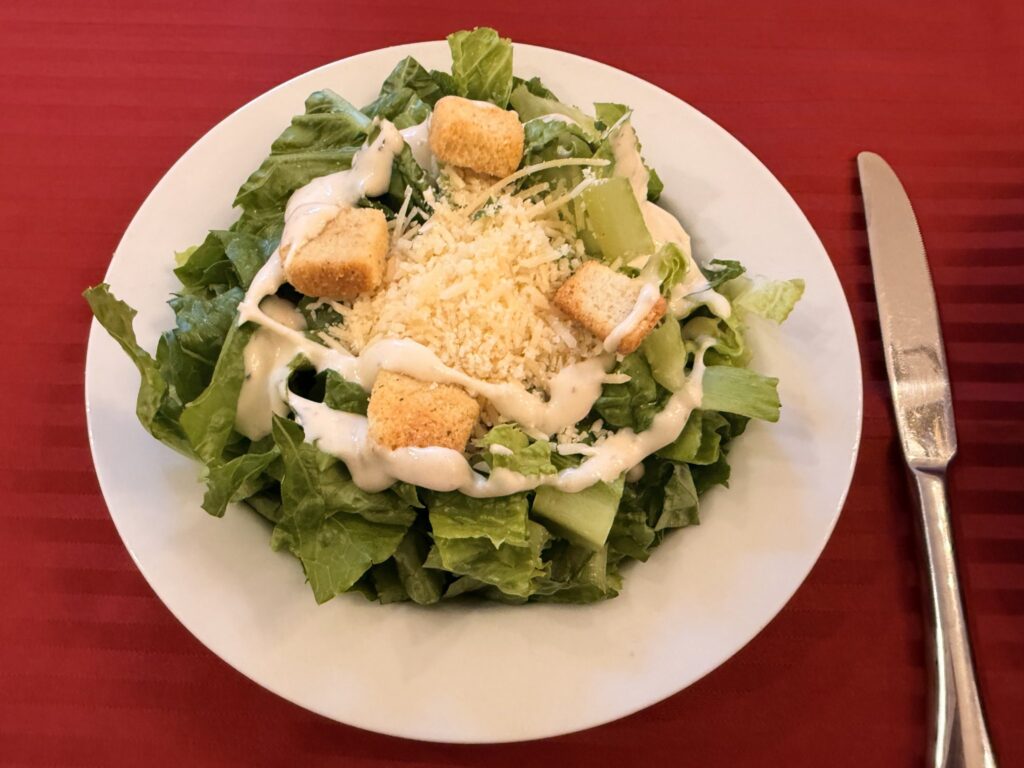 Classic Caesar salad with croutons and Parmesan