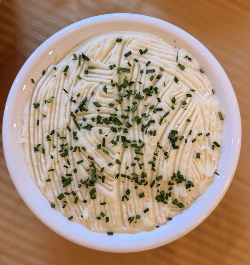 Creamy butter and milk mashed potatoes with chives