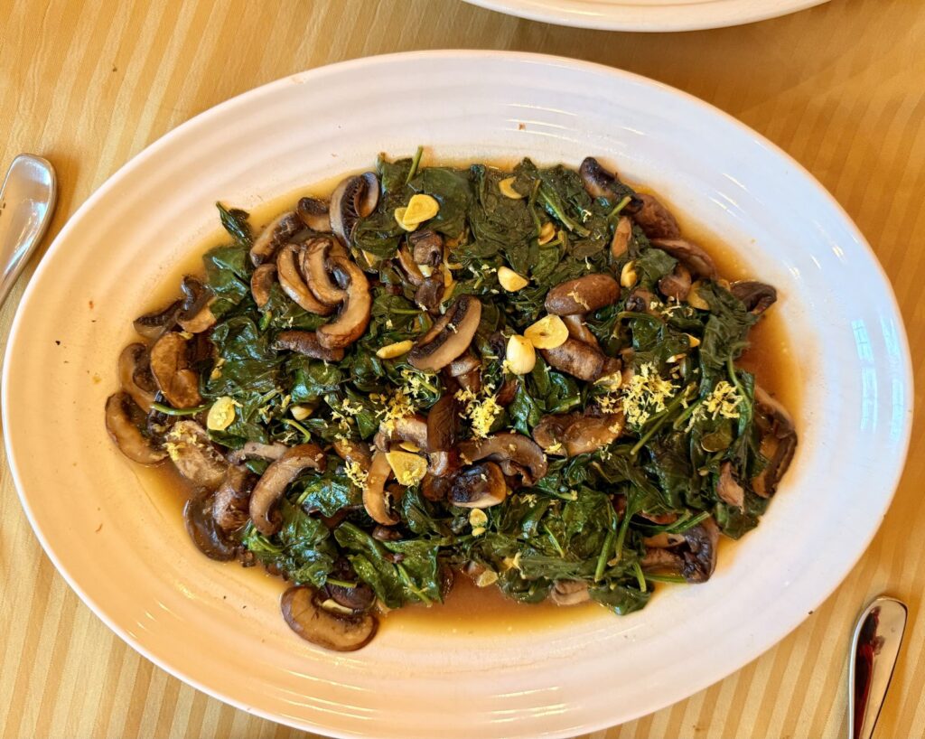 Sauteed baby spinach with portobello mushrooms and saffron-garlic butter