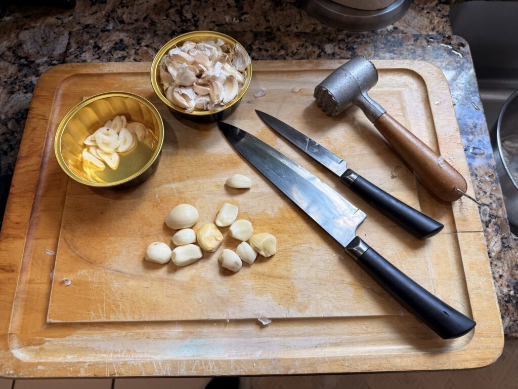 Chef Nino preparing fresh garlic in a client's kitchen