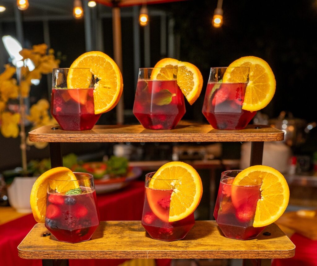 Tinto de Verano Refresh with berries, mint and orange slices on a tiered stand